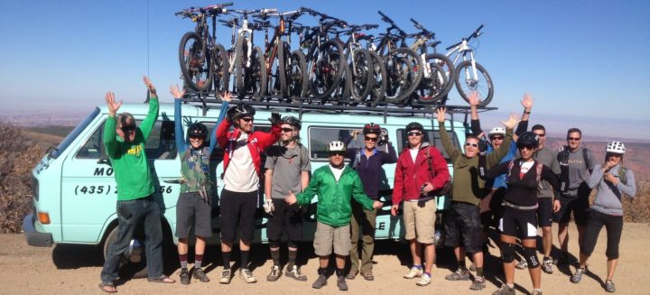 Bikers with green van in Moab